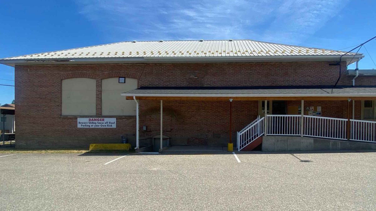 The brick exterior of the Armstrong Odd Fellows Hall on Wood Avenue, with its covered entrance and ramp