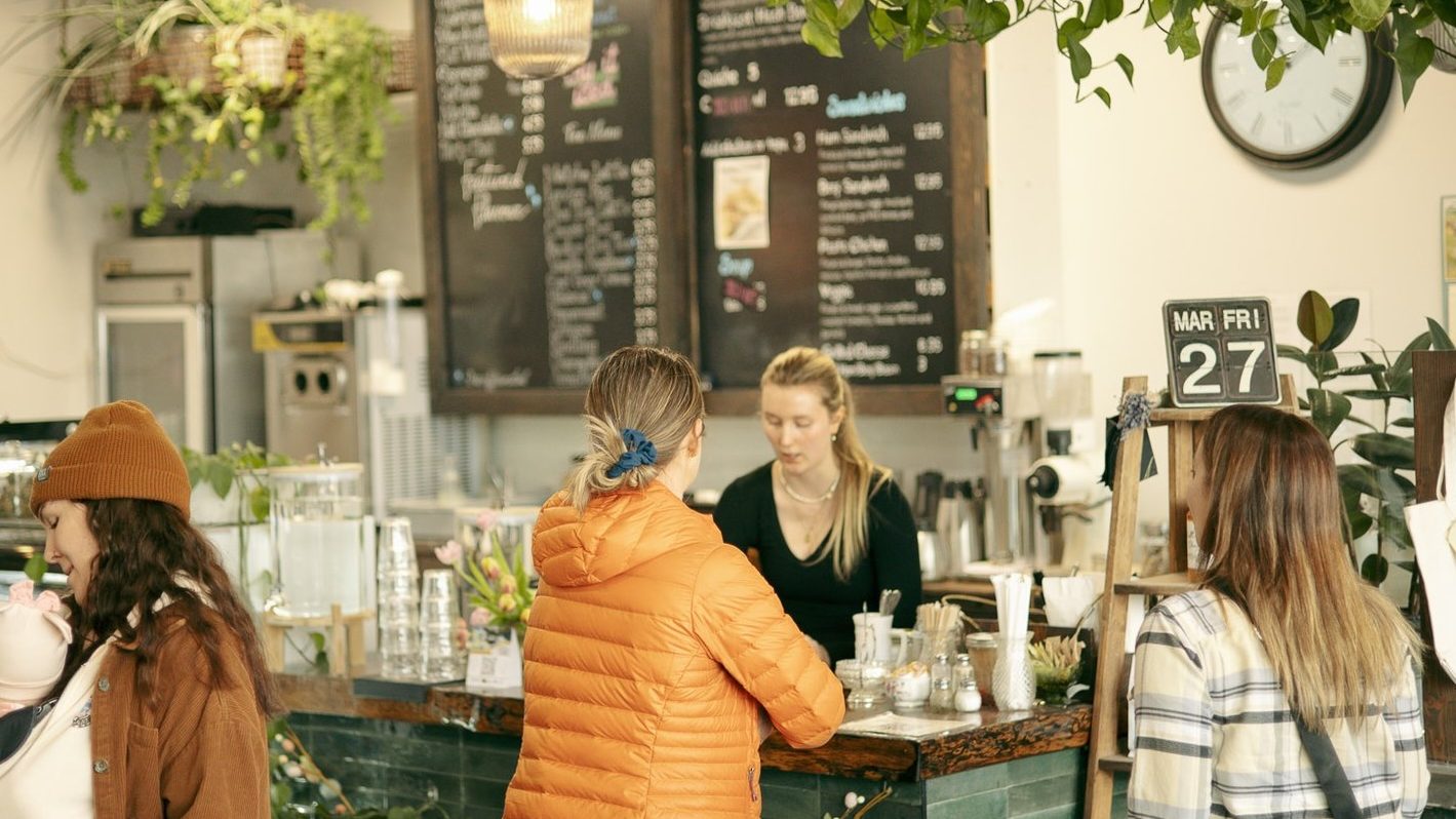 Customers at the counter inside PV Blvd Coffee in Armstrong, BC