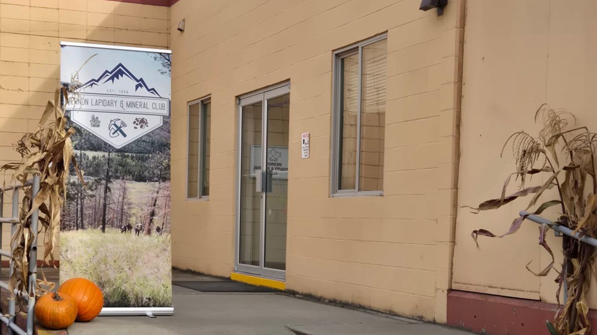 The entrance to the Vernon Lapidary and Mineral Club on Pleasant Valley Road in Armstrong, with the club banner and fall pumpkins