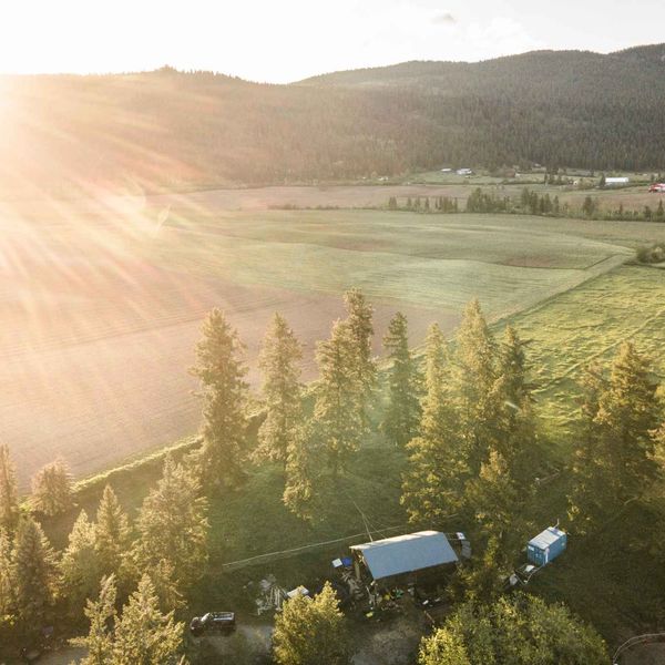 Farmland and forest in the valley around Armstrong at sunset