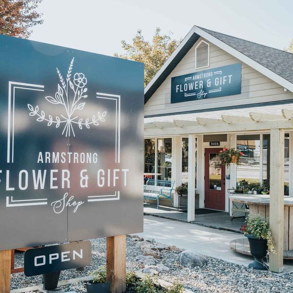 The Armstrong Flower and Gift Shop storefront with its open sign