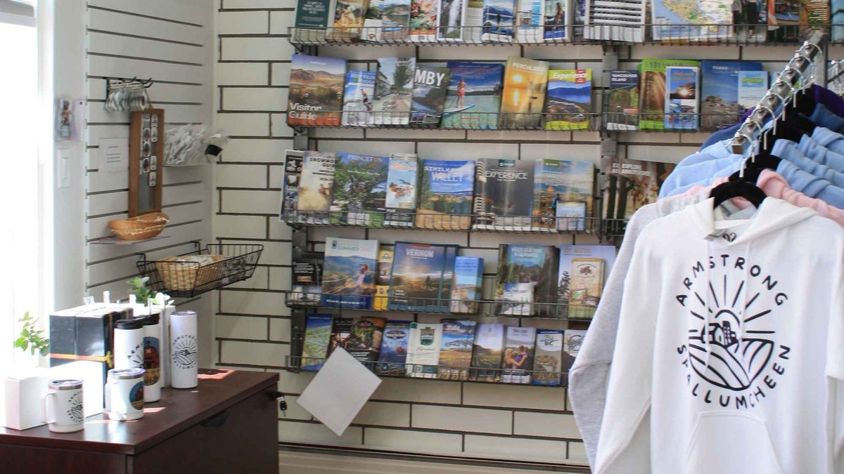 Inside the chamber office, with brochure racks and the shop-local display