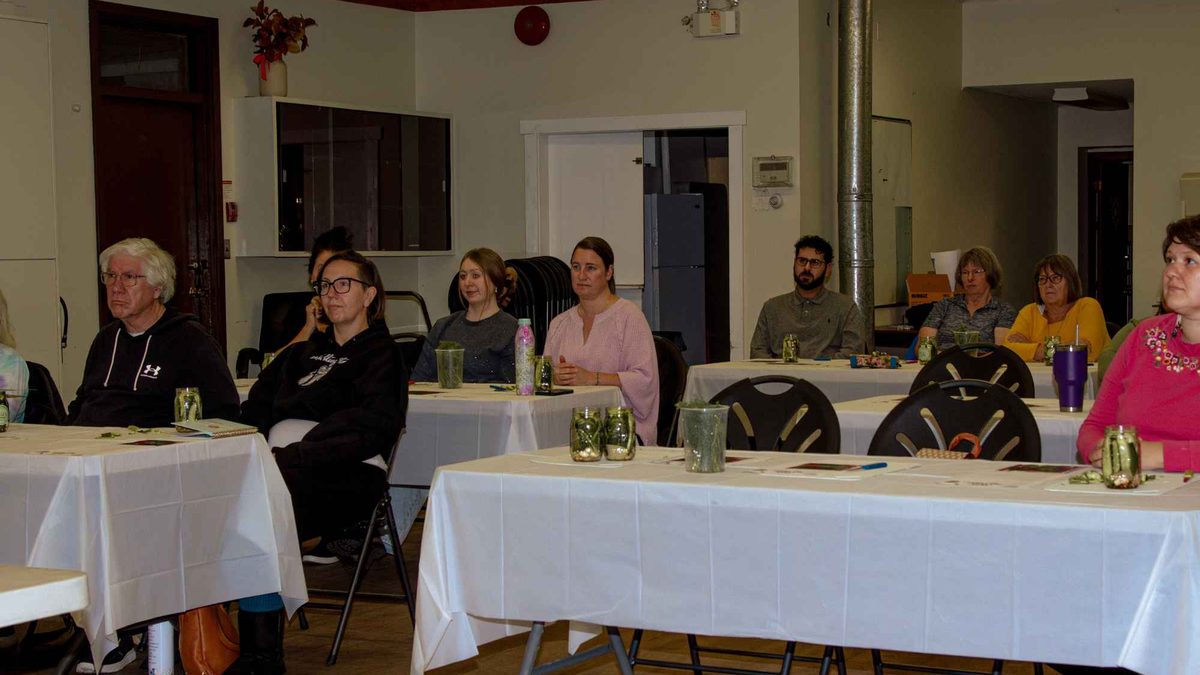 Participants seated at tables for a chamber workshop in the Odd Fellows Hall